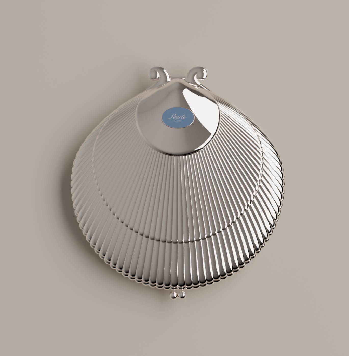 Silver shell-shaped caviar serving shell (top shell) with a blue label on a beige background